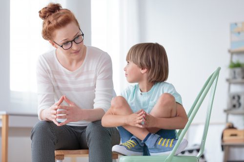 Adult talking to boy