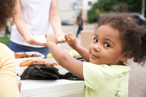 child getting served food